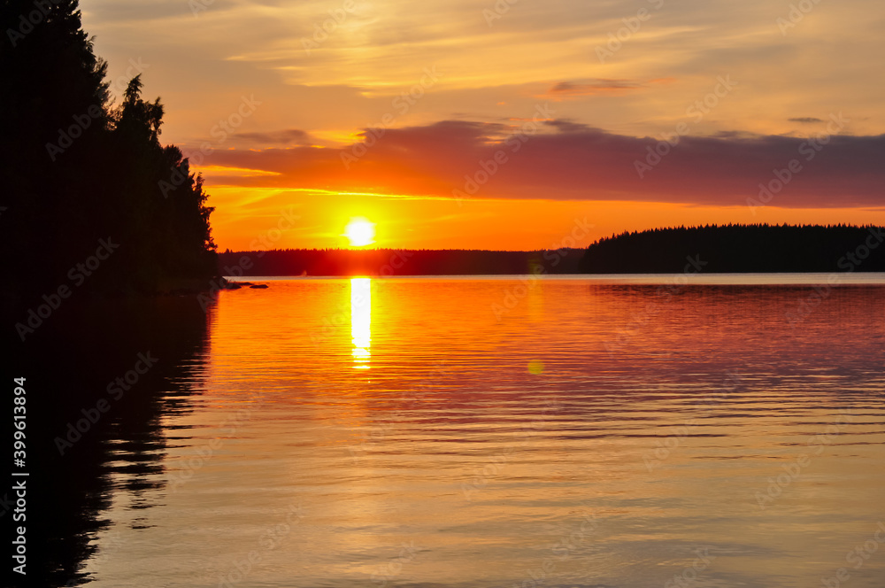 Scenic summer sunset over lake near Lappeenranta, Finland