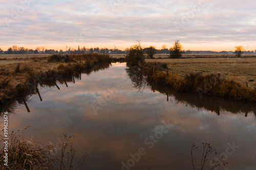 sunrise over the river in a cold winter morning  wide landscape