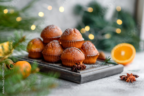 Beautiful delicious fresh cocoa muffins on the Christmas table