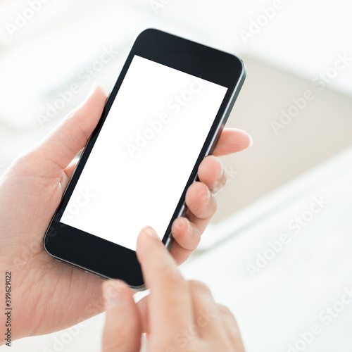 Man holding a smartphone isolated on white background.