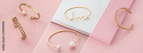 Fényképezés Modern golden bracelets on pink and white slanted layout