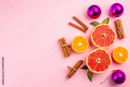 top view tasty grapefruits fruit slices with cinnamon on pink background mellow color diet citrus fresh juice fruit free place © Kamran
