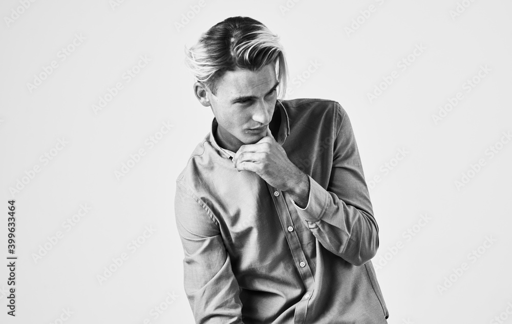Romantic man in shirt gesturing with hands black and white photography light background cropped view Romantic man in shirt gesturing with hands black and white photography light background cropped view
