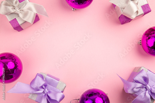 top view cute little presents with xmas tree toys on a pink background gift color new year christmas photo