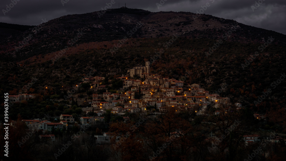 Fototapeta premium Eus à la tombée du jour, a small catalan village in the mountain brighting at dusk