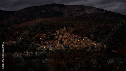 Eus à la tombée du jour, a small catalan village in the mountain brighting at dusk