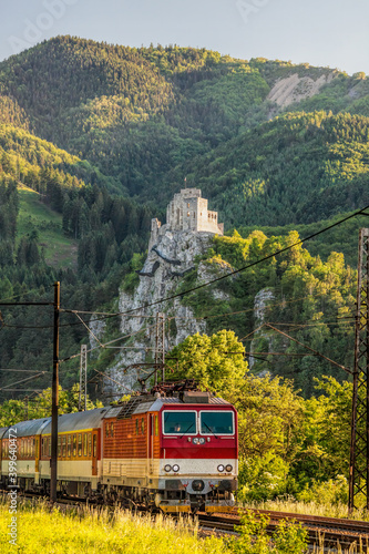 Train against Strecno castle in Slovakia with beautiful nature