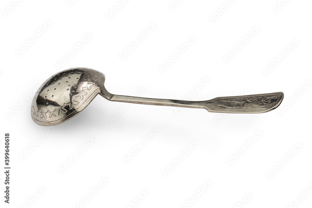 antique silver spoon-strainer for tea, isolate on a white background antique silver spoon-strainer for tea, isolate on a white background