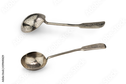 antique silver spoon-strainer for tea, isolate on a white background