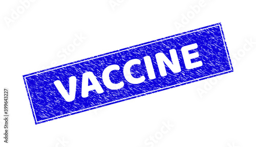 Grunge VACCINE rectangle stamp seal. VACCINE carved shape caption is located inside rectangle with frame. Rectangular seal with grunge texture in blue color.