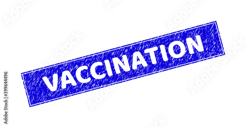 Grunge VACCINATION rectangle stamp. VACCINATION subtraction caption is located inside rectangle with frame. Rectangular seal with grunge texture in blue color.