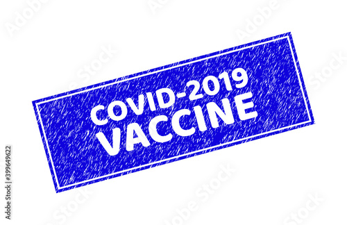 Grunge COVID-2019 VACCINE rectangle stamp seal. COVID-2019 VACCINE carved shape label is located inside rectangle with border. Rectangular seal with grunge texture in blue color.