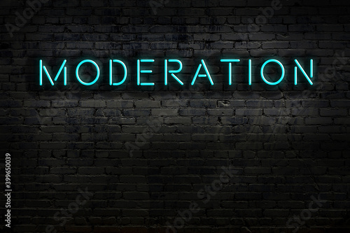 Slika na platnu Neon sign. Word moderation against brick wall. Night view