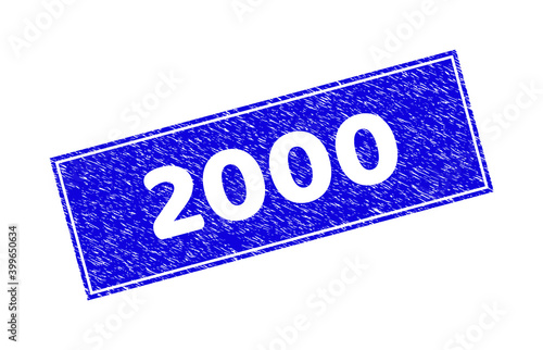 Grunge 2000 rectangle stamp seal. 2000 carved shape label is located inside rectangle with border. Rectangular seal with grunge texture in blue color.
