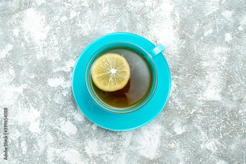 top view cup of tea with lemon slice on light background drink photo color tea ceremony breakfast