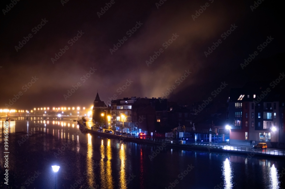 Small Belgian town Dinant on Meuse river in Walloon, Belgium at night