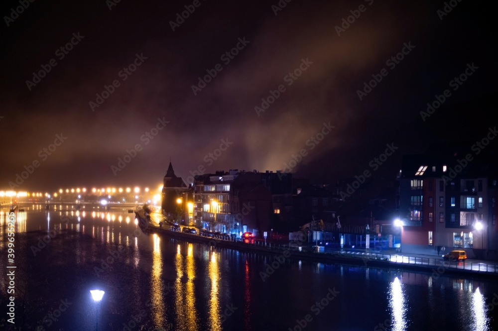Fototapeta premium Small Belgian town Dinant on Meuse river in Walloon, Belgium at night
