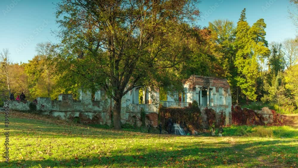 Beautiful timelapse in the autumn park. Ruin. Yellow and green trees. People sightseeing. Beautiful timelapse in the autumn park. Ruin. Yellow and green trees. People sightseeing.