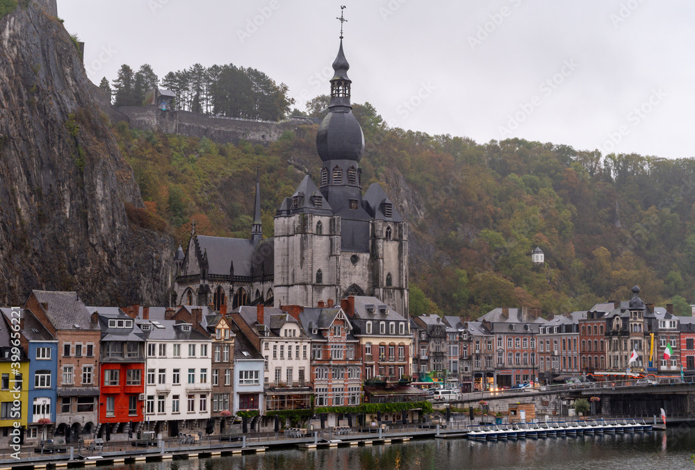 Rainy day in small Belgian town Dinant on Meuse river in Walloon, Belgium at night
