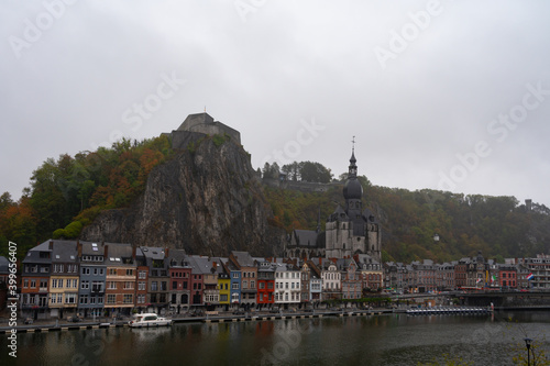Rainy day in small Belgian town Dinant on Meuse river in Walloon, Belgium at night