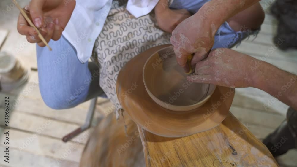 Making a handmade clay pot in the workshop. Pottery lesson with master. Making a handmade clay pot in the workshop. Pottery lesson with master.