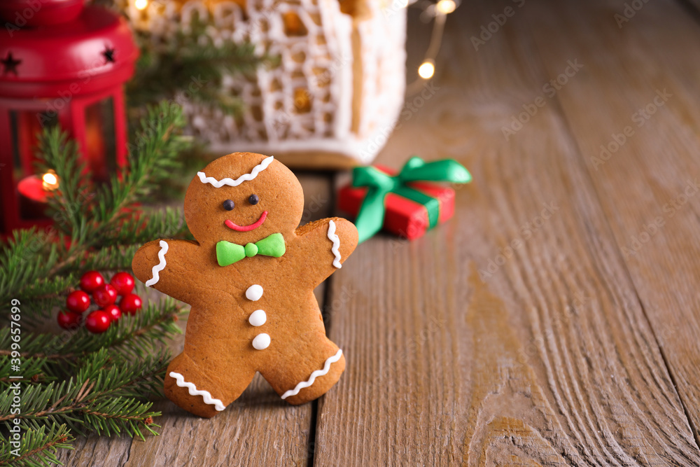 Gingerbread man on wooden table, space for text Gingerbread man on wooden table, space for text