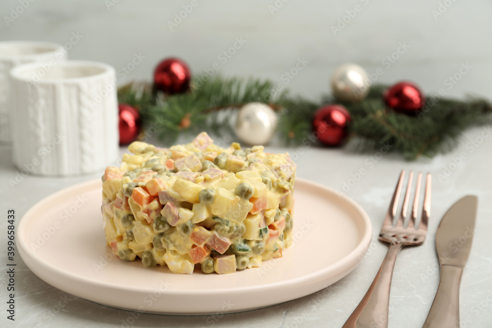 Fresh Russian salad Olivier served on grey table Fresh Russian salad Olivier served on grey table