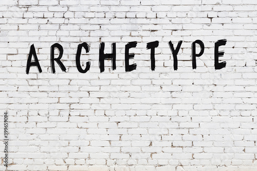 Foto Inscription archetype painted on white brick wall
