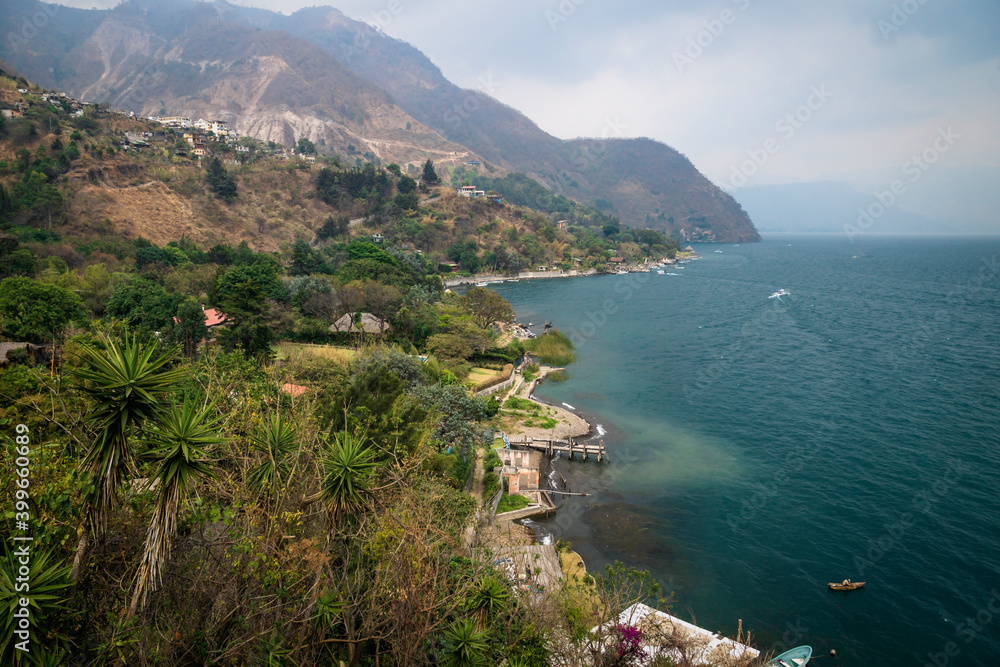 Top view on the coast with boat docks along lake Atitlan at Santa Cruz la Laguna, Guatemala