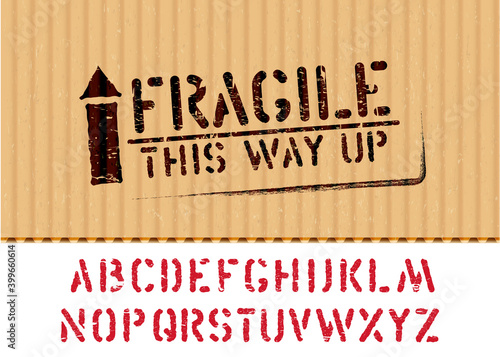 Grunge Fragile box sign with arrow up on piece of carton for logistics or cargo and alphabet. Means this way up, handle with care. Vector stencil font