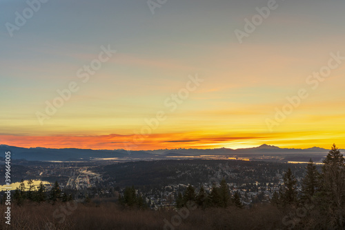panoramic golden-orange sunrise over BC valley  mountains and water