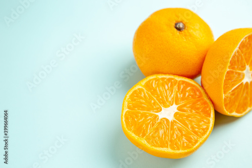 front view fresh tangerine slices on light-blue background fruit color orange photo citrus