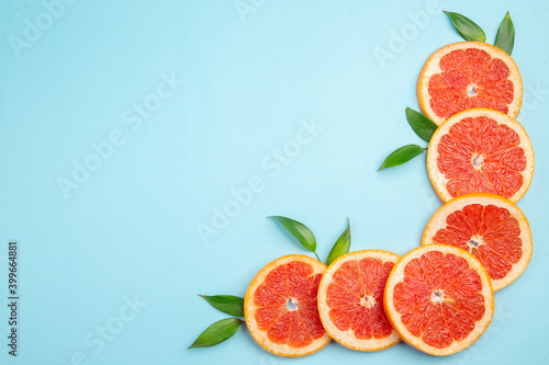 top view fresh grapefruits fruit slices on blue background fruit citrus fresh juice photo color