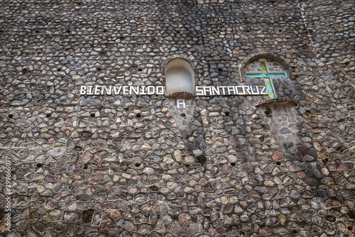 Letters on natural stone wall at the entry of village saying 'Welcome to Santa Cruz' at Santa Cruz La Laguna, Guatemala photo