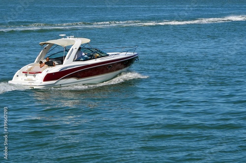 High-end motor boat cruising on the Florida Intra-Coastal Waterway.