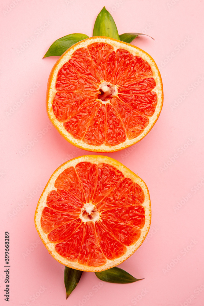 top view tasty grapefruits fruit slices on a pink background mellow fresh fruit juice color diet citrus top view tasty grapefruits fruit slices on a pink background mellow fresh fruit juice color diet citrus