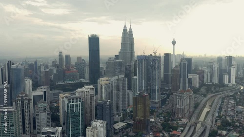 Wallpaper Mural Dolly out aerial of Kuala Lumpur skyline, Petronas Twin Towers in backlight Torontodigital.ca