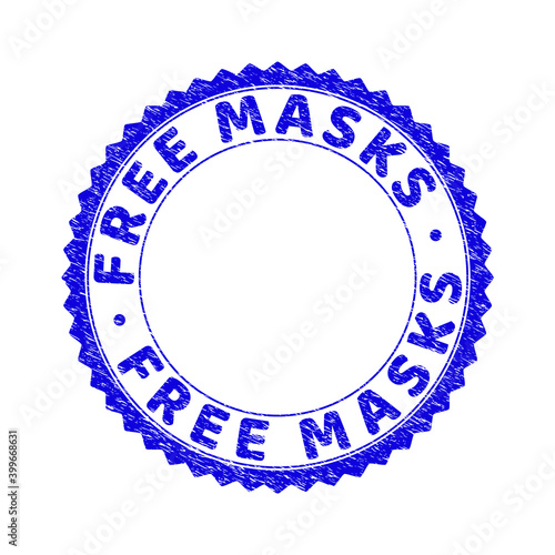 Grunge FREE MASKS round rosette stamp seal. Empty space inside circle. Vector blue rubber imprint of FREE MASKS text inside round rosette. Stamp seal with dirty style. photo