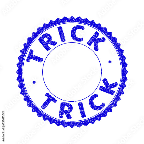 Grunge TRICK round rosette stamp seal. Copy space inside circle. Vector blue rubber imprint of TRICK caption inside round rosette. Stamp seal with dust texture. Seal with grunge texture in blue color.