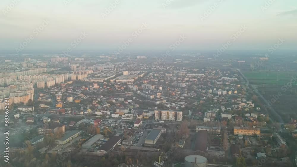 Cityscape of Bucharest, multiple buildings, roads, industrial facility on the foreground, panorama view from the drone flying through the foam, Romania Cityscape of Bucharest, multiple buildings, roads, industrial facility on the foreground, panorama view from the drone flying through the foam, Romania
