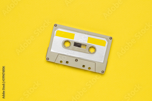 Vintage tape recorder on a yellow background.