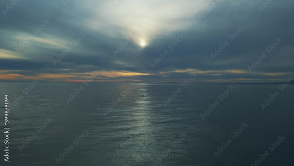 Aerial view over the sea with dark clouds on the horizon Aerial view over the sea with dark clouds on the horizon