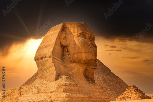 Sphinx And Pyramids In Giza At Very Dramatic Sunset