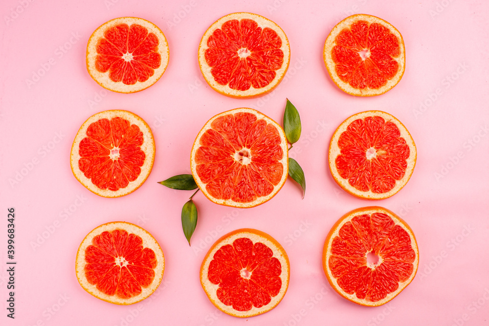 top view tasty grapefruits sliced juicy fruits lined on pink background healthy life juice fresh color diet fruits top view tasty grapefruits sliced juicy fruits lined on pink background healthy life juice fresh color diet fruits