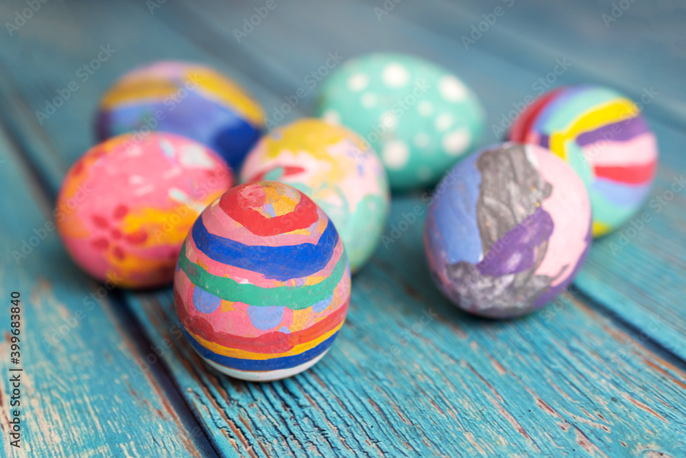 Fototapeta premium Colorful Easter eggs on table. Easter festive holidays concept.