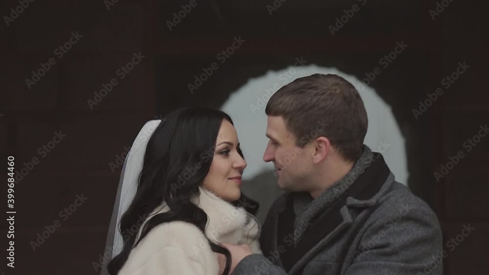 a couple in love hugs. A man and a woman look into each other's eyes. the bride and groom kiss on Valentine's day. February 14 a couple in love hugs. A man and a woman look into each other's eyes. the bride and groom kiss on Valentine's day. February 14