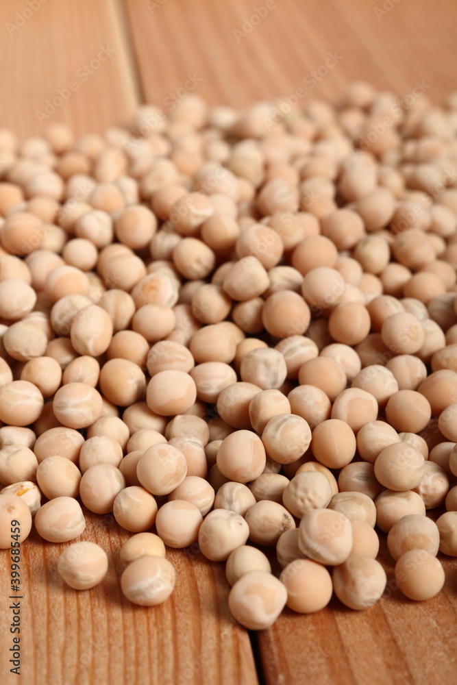 Whole yellow peas at wooden plank background Whole yellow peas at wooden plank background