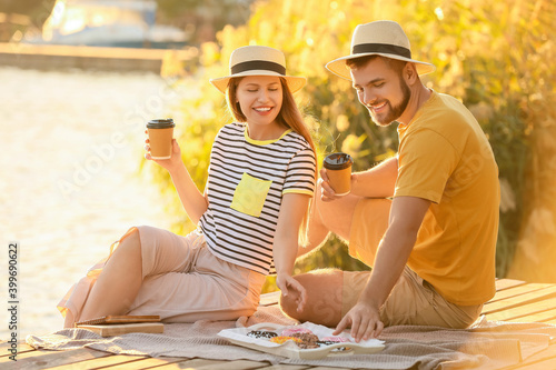 Young couple eating sweet d...