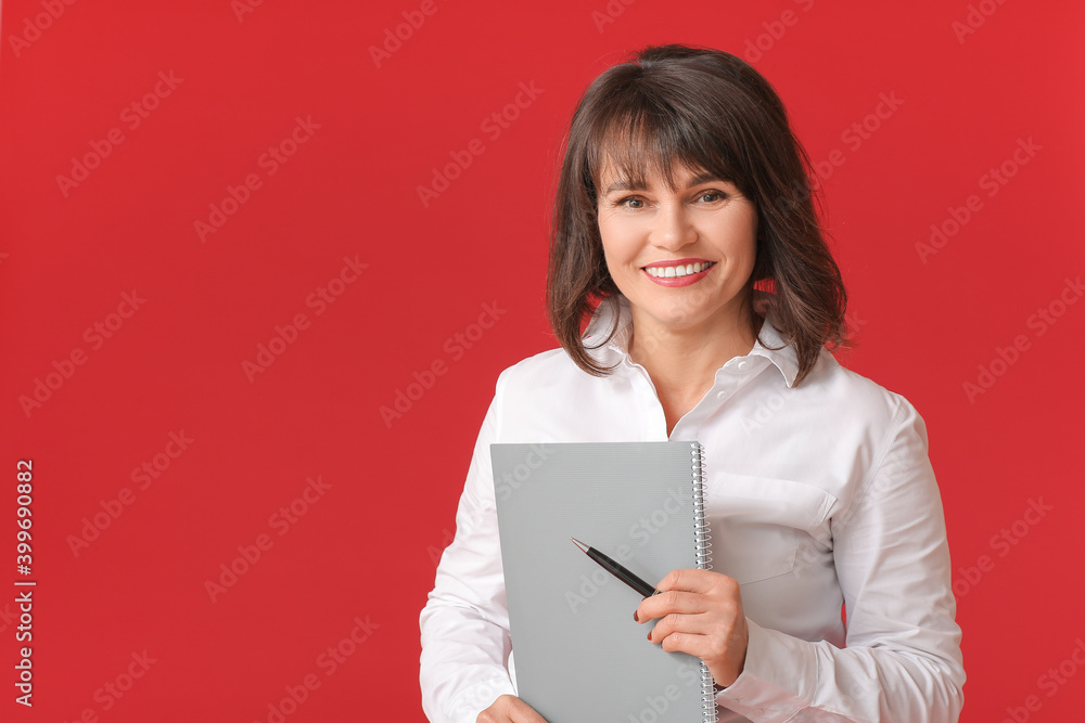 Beautiful mature businesswoman on color background Beautiful mature businesswoman on color background