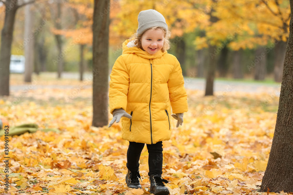 Cute little girl in autumn park Cute little girl in autumn park